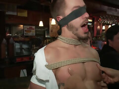 Submissive male gets intimate with a bunch of men at the pub