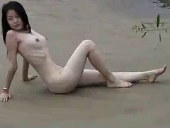 chinese model poses nude outdoors