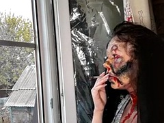 Wife smokes a cigarette makeup zombie