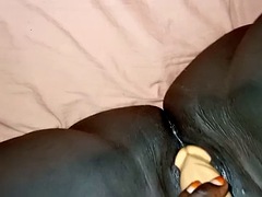 Black bitch plays with a dildo, she wants a white man too
