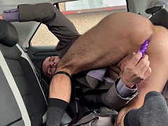 Businessman in socks has sex in the car using a dildo