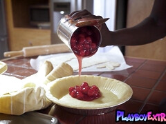 Provocative ebony young cutie cooking and stripping