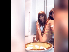 Cuties Abbie Maley and Riley Reid caress each other in the kitchen