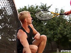 Obese woman facesits on her trainer at the tennis court