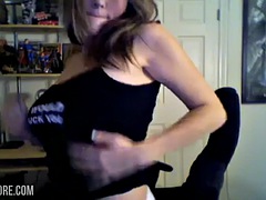 cute teen strips in front of her webcam