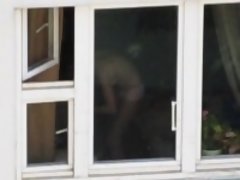 Neighbor sets up his spy cam to catch his neighbor taking a