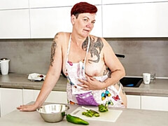 Redhead mature lady Gia R is sucking with vegetables