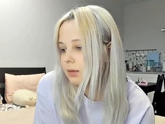 Blonde teen with huge tits plays with her pussy