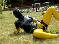 jerk with inflatable faux-cock in spandex catsuit