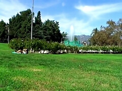 naked in public park sunbathing