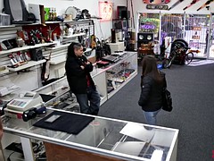 Two nasty  bitches try to steal at the pawnshop