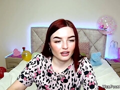 Big tits redhead strips to bra