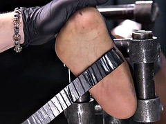Ebony subject feet whipped by maledom in sensory deprivation