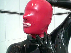 crimson + Black Latex Catsuit Girl And High Heel torment - Rubber bitch Heeljob