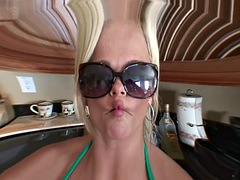 Christa Moore poses with big tits in a striptease