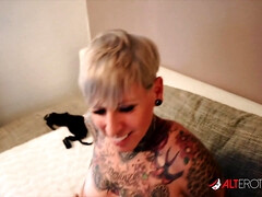 Lady Kinky Cat, the tattooed German MILF, loves taking a big cock in her mouth and pussy