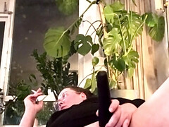 Playing with a magic wand and smoking
