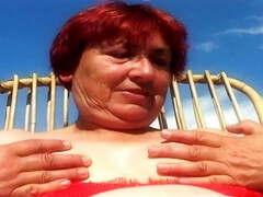 Busty Redhead Granny Surrenders to Intense Garden Passion