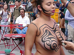 stunning bare-chested woman Getting Painted